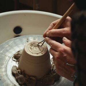 person holding brown wooden stick